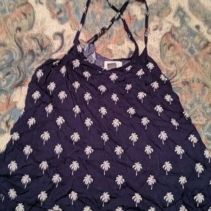 Tank with criss cross adjustable straps